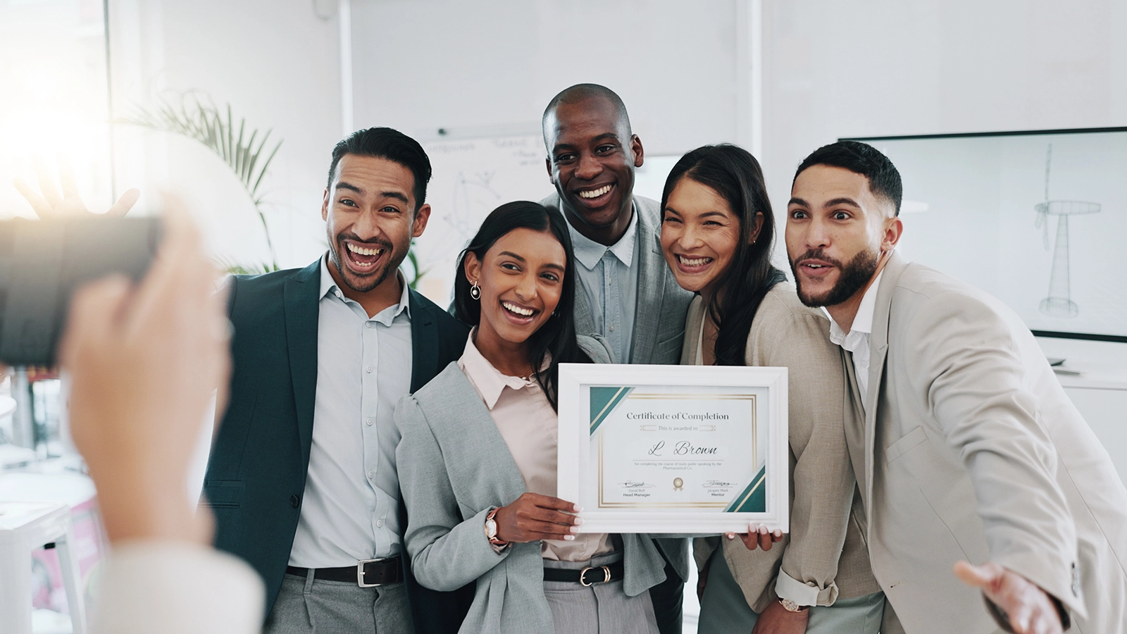 company-award Employees celebrating a company award together