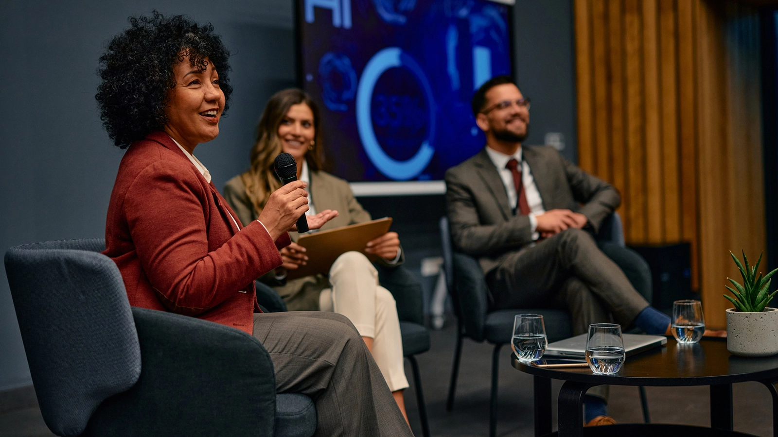 Executive participating in a panel speaking engagement at an industry conference